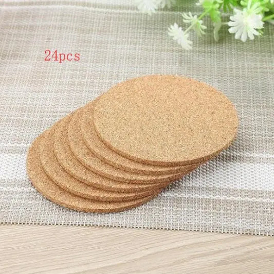 Set of 24 cork coasters on a textured surface with flowers in the background